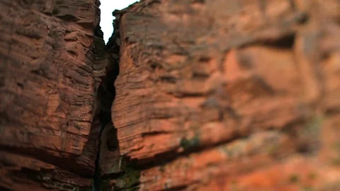 Waterfall flowing between two large rocks. Stock Footage 88438409