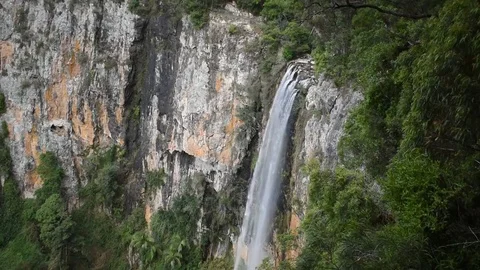 Waterfall flowing in canyon Stock Footage 74754524