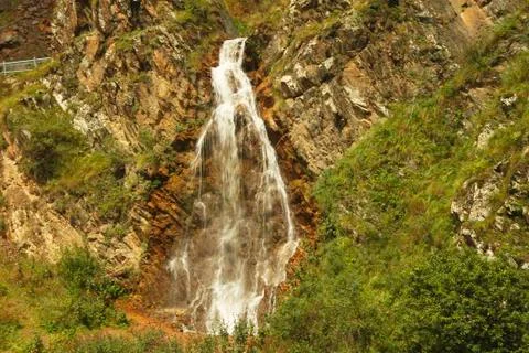 Waterfall flowing down between a caucasus mountains of North Caucasus Stock Photos