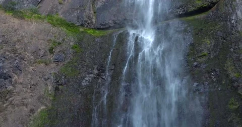 Waterfall flowing down the cliff - 4K Nature Stock Footage 228702796