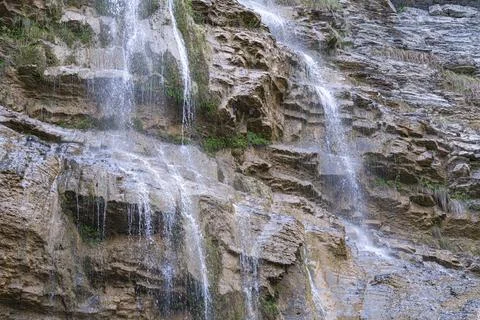 Waterfall flowing down from a cliff close-up Stock-Fotos