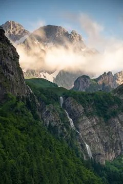 A waterfall flowing down a steep mountain 写真素材