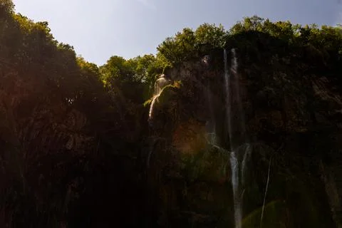 Waterfall flowing down a steep rocky cliff in Plitvice Lakes National Park,.. Stock Photos