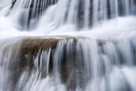 Waterfall flowing fall on limestone Stock Photos