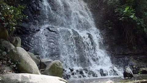 Waterfall flowing foaming over the rocks Stock Footage 321008021