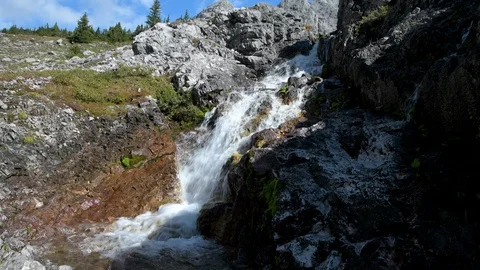 Waterfall flowing in the mountains Stock Footage 117973162