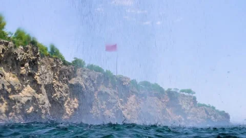 The Waterfall is Flowing Over the Cliff Falls into the Sea, Slow Motion Stock Footage 146338364