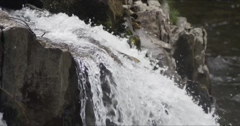 Waterfall Flowing over Rock Stock Footage 152863500
