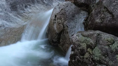 Waterfall flowing over rocks Stock Footage 56297347