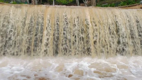 Waterfall Flowing Over Small Dam – Natural Water Cascade Close Up Video stock 328683603