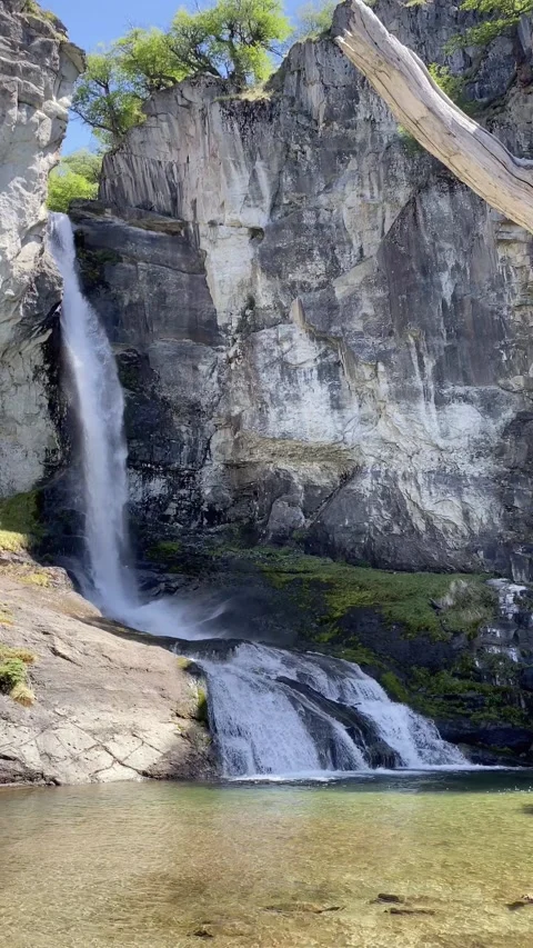 A waterfall is flowing into a pool of water. El Chalten Stock Footage 277550886