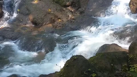 Waterfall Flowing with Rainbow Forming in Water Splash 库存影片 337033279