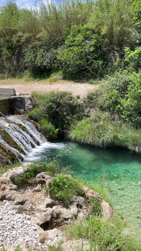 A waterfall is flowing into a river Stock Footage 277410399