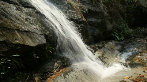 Waterfall flowing on rock Stock-Footage 664295