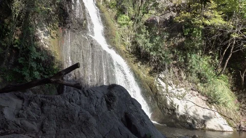 Waterfall flowing through a rock Stock Footage 118262032