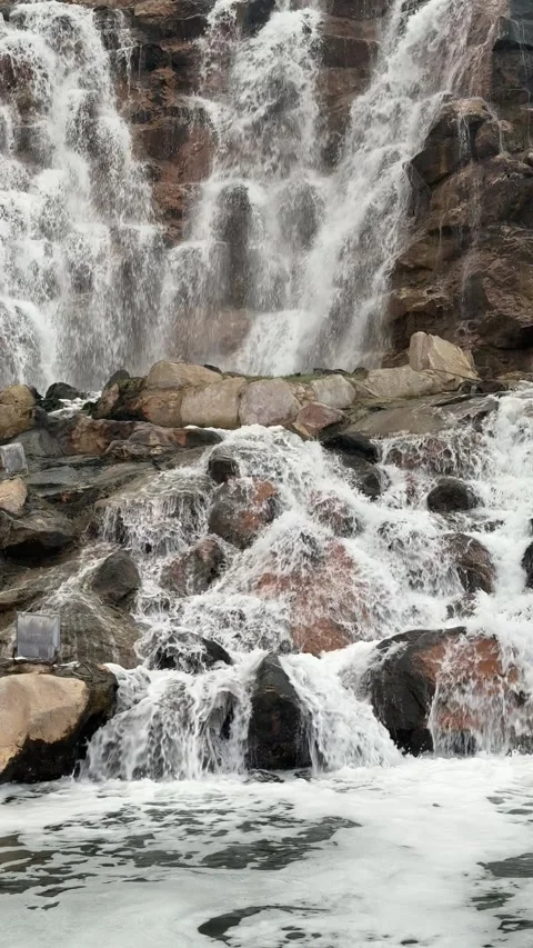 Waterfall flowing through Wadi Adai in Qurum Natural Park Stock Footage 325903450
