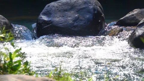 Waterfall flowing trough stone in forest on mountain and sunset. Stock Footage 87253154