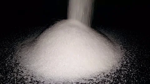 A waterfall flowing like white sugar on black background Stock Footage 83876981
