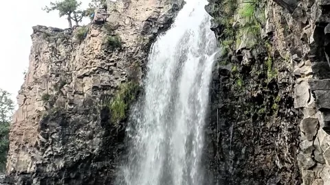 This waterfall flows across ancient basalt lava fields Stock Footage 340268015