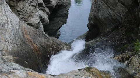 Waterfall flows down to the river Stock Footage 281639372