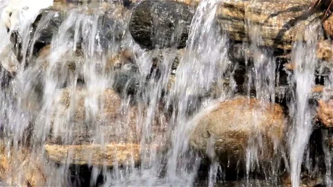 The waterfall flows down from the rocks Stock Footage 74636004