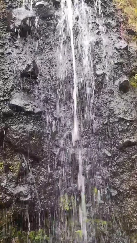 Waterfall flows on mountain rocks Stock Footage 273634197