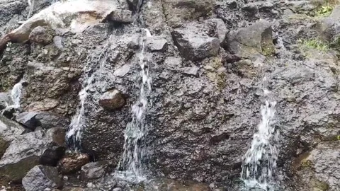 Waterfall flows on mountain rocks Stock Footage 273634199