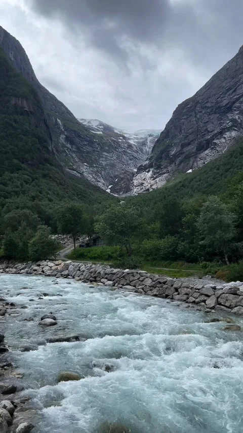 A waterfall flows from the mountains Video stock 337364971