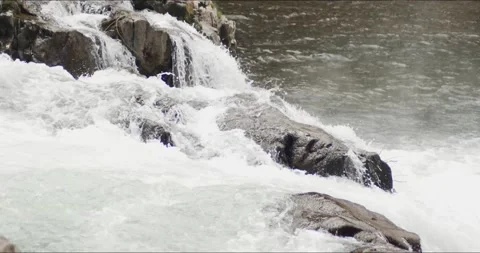 Waterfall Flows over Rapids Rock Stock Footage 152863505