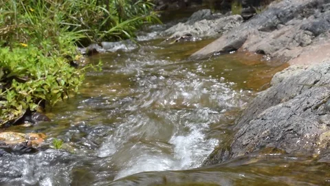 The waterfall flows sloly from the hight ground Stock Footage 129694176