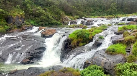 This waterfall flows through the Nilgiri Hills landscape Stock Footage 340267836