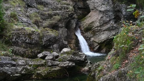 Waterfall flushes into a pond in autumn 스톡 동영상 260826853