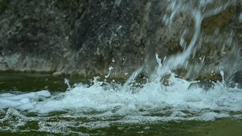 Waterfall flushing into a natural pool with green water (slow motion) Stock-Footage 211761376