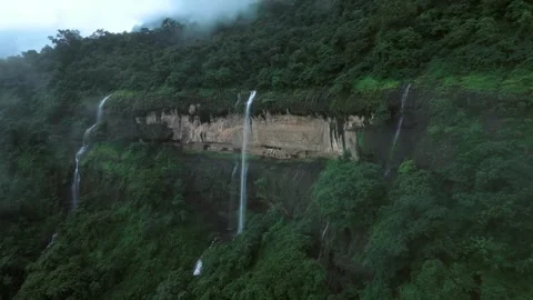 Waterfall in the forest and mountains. view from air with drone camera. Stock Footage 285931071