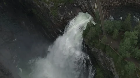 Waterfall in the forest canyon tilting down and going forward version 1 Stock Footage 255380779