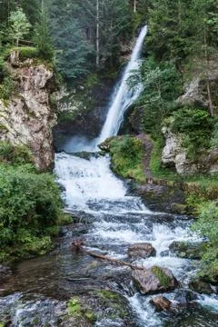 Waterfall in the forest, dolomites Stock Photos
