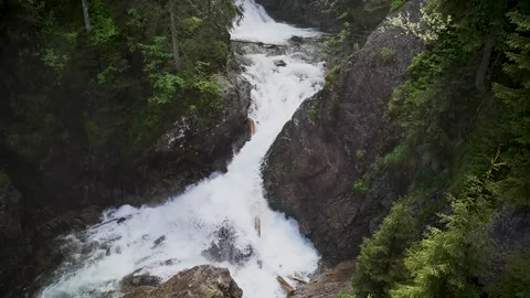 Waterfall in the forest flows down the rocks Stockbeeldmateriaal 204762261