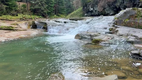 Waterfall in the forest. Mountain river with a clear water. Stock Footage 254521768