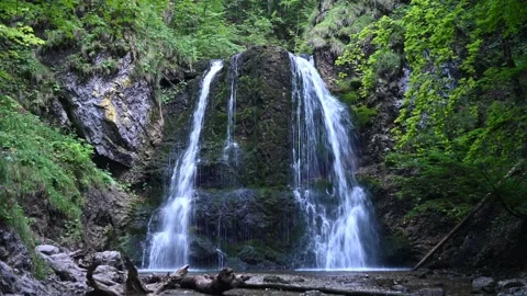 A waterfall in a forest in the mountains (cloudy, blue light) Stock-Footage 217381594