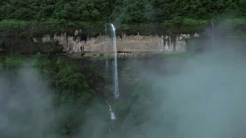 Waterfall in the forest or mountains, waterfall and smoke in mountains Stock Footage 285930866
