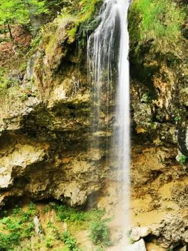 A waterfall in a forest Stock Photos