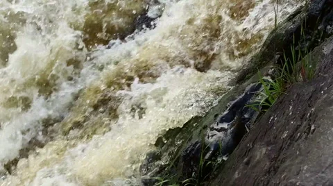 Waterfall on the forest river in slow motion. Close up Video stock 68149597