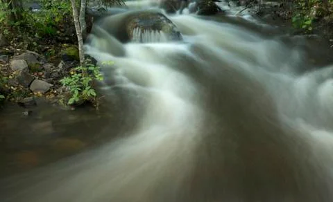 Waterfall on the forest stream Stock Photos
