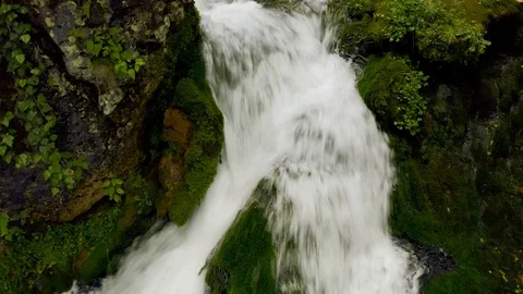 Waterfall in the forest, water flows down the stones, drone shooting Video stock 120307563