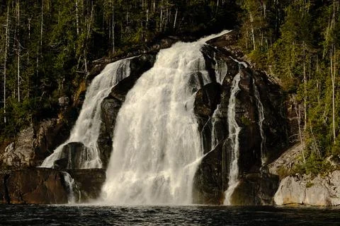 Waterfall on a forested cliff 21 Stock Photos