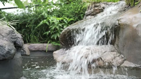 Waterfall fountain for tropical garden Stock Footage 147963853