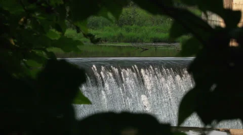Waterfall in a frame of leaves Stock Footage 67843535