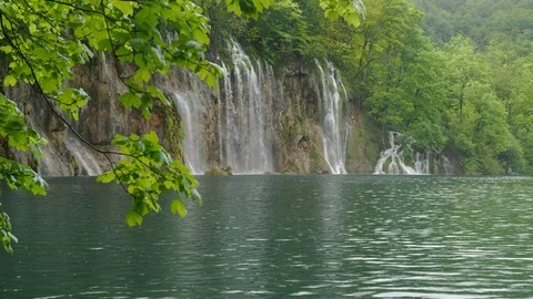 Waterfall framed by a tree at plitvice lakes national park Stock Footage 122725166