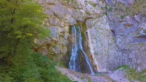 Waterfall Gega - Flows From the Rock. Summer, Green Trees , Cascade. Shooting Stock Footage 94742973