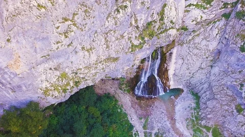 Waterfall Gega - Flows From the Rock. Summer, Green Trees , Cascade. Shooting Stock Footage 94743103
